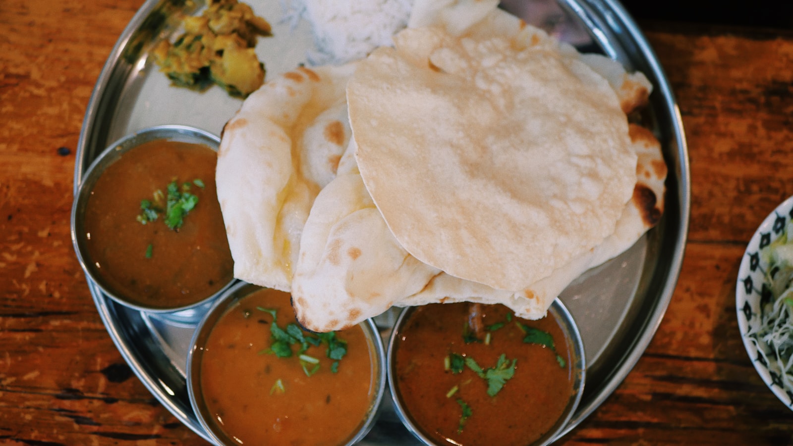 A Spice of India thali with naan, dals and curries